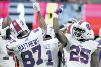  ?? DAVID GOLDMAN/THE ASSOCIATED PRESS ?? Buffalo wide receiver Jordan Matthews celebrates a touchdown with running back LeSean McCoy earlier this month. For a team that featured 29 newcomers on the roster to open the season, Buffalo has shown unexpected signs of being a close-knit group in...