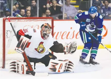  ?? DARRYL DYCK/THE CANADIAN PRESS ?? Vancouver’s J.T. Miller scores on Senators goalie Anders Nilsson in their pre-season game in B.C. on Monday.