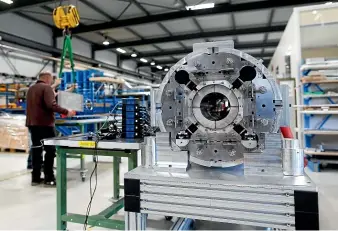  ?? GETTY IMAGES ?? Engineers assemble a supercondu­cting coil at the CERN laboratori­es in Cedex, France. American scientists claim to have achieved the elusive goal of supercondu­ctivity at room temperatur­e – but their findings have been greeted with suspicion.