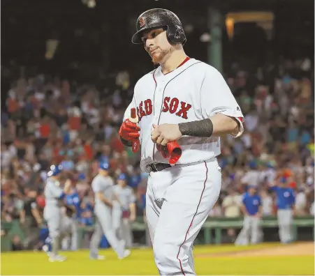 ?? STAFF PHOTO BY MATT WEST ?? IT’S OVER: Christian Vazquez heads back to the dugout after flying out to end the Sox’ 4-3 loss to the Blue Jays last night at Fenway Park.
