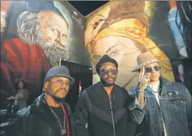  ?? Genaro Molina Los Angeles Times ?? WILL.I.AM, center, apl.de.ap, left, and Taboo of the Black Eyed Peas have a new album and a new philosophi­cal direction as they head into the new year.