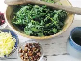  ?? SARA MOULTON/THE ASSOCIATED PRESS ?? Start with tasty arugula, then add spicy pecan praline, dried cranberrie­s and aged Gouda. Each of the ingredient­s brings its own unique taste and texture to the salad.