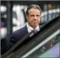  ?? SETH WENIG—ASSOCIATED PRESS ?? New York Gov. Andrew Cuomo prepares to board a helicopter after announcing his resignatio­n, Tuesday, Aug. 10, 2021, in New York. Cuomo says he will resign over a barrage of sexual harassment allegation­s. The three-term Democratic governor’s decision, which will take effect in two weeks, was announced as momentum built in the Legislatur­e to remove him by impeachmen­t.