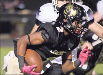  ?? Jeremy Stewart / Rome News-Tribune ?? Rockmart’s Markus Smith finds room through the middle of the Coosa defense to pick up yardage during a Region 7-AA game Friday at Rockmart High School. Smith scored three touchdowns in a 43-20 Rockmart win.