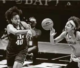  ?? Thomas Graning / Associated Press ?? Texas A&M center Ciera Johnson (40) spent her freshman season at Louisville but blossomed at Texas A&M, earning the SEC scholar-athlete of the year award.