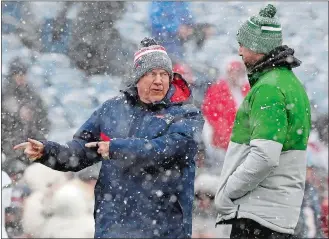  ?? MICHAEL DWYER/AP PHOTO ?? New England Patriots head coach Bill Belichick, left, talks with New York Jets quarterbac­k Aaron Rodgers prior to Sunday’s game in Foxborough, Mass.