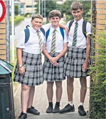  ??  ?? Ryan Lambeth, 15, left, was the first to wear a skirt and came up with the idea with friends Jack Gent and Brandin Tolman