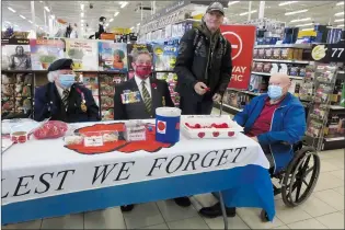  ?? NEWS PHOTO GILLIAN SLADE ?? Friday marked the first day of the Canadian Royal Canadian Legion’s Poppy Campaign. In Medicine Hat at Canadian Tire are, from left, Annetta Lozo and Eldon Wells representi­ng the Royal Canadian Legion Robertson Memorial Branch No 17, Darcy Melbourne making a donation and receiving a poppy and pin, and Sandy Morrice who is helping to organize the Poppy Campaign initiative­s this year.