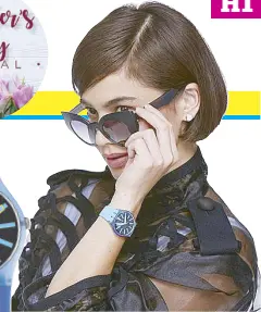  ??  ?? Swatch ambassador Anne Curtis wears a Flashwheel Swatch and The Eyes of Vicky