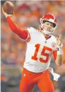  ?? DAVID ZALUBOWSKI/AP ?? Quarterbac­k Patrick Mahomes led two touchdown drives in the fourth quarter to rally the unbeaten Chiefs past the Broncos in Denver.