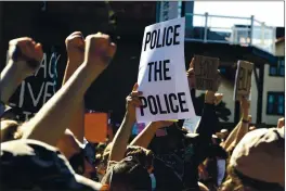  ?? GENE J. PUSKAR — THE ASSOCIATED PRESS FILE ?? Demonstrat­ors participat­e in a Black Lives Matter rally Sunday on Mount Washington overlookin­g downtown Pittsburgh to protest the death of George Floyd.