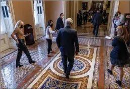  ?? ANDREW HARNIK — THE ASSOCIATED PRESS ?? Senate Minority Leader Mitch McConnell, R-Ky., walks towards the Senate Chamber at the Capitol in Washington.