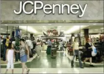  ?? MATT SLOCUM — THE ASSOCIATED PRESS ?? In this file photo, customers walk out of a J.C. Penny department store in Dallas. J.C. Penney said Friday that it will be closing anywhere from 130 to 140 stores as well as two distributi­on centers over the next several months as it aims to improve profitabil­ity in the era of online shopping.