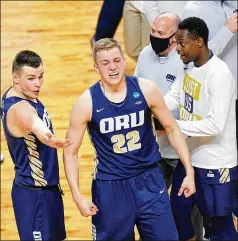  ?? AJ MAST/ASSOCIATED PRESS ?? No. 15 seed Oral Roberts with Francis Lacis (22) is among the upstarts in the Sweet 16 after ousting a No. 7 (Florida) Sunday. The seed numbers of the 16 remaining teams add up to 94, the highest total since the NCAA Tournament expanded in 1985, topping the previous high of 89.