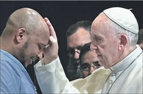  ?? CTV / Célestes / Solares / Neue Road Movies, Decia, PTS ART’s Factory ?? POPE FRANCIS blesses a man in a detention center in footage from Wim Wenders’ documentar­y on the controvers­ial Catholic leader.