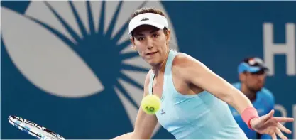  ?? —AFP ?? BRISBANE: Garbine Muguruza of Spain hits a return against Samantha Stosur of Australia in the women’s round one at the Brisbane Internatio­nal tennis tournament in Brisbane yesterday.