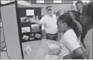  ?? / Spencer Lahr ?? Coosa Valley Habitat for Humanity Executive Director Bruce Day talks about his organizati­on’s work with participan­ts in the Summer Explosion Camp at Lovejoy Baptist Church.