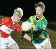  ??  ?? Adam Doyle of Buffers Alley under pressure from Fethard’s Cian Byrne.