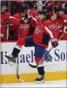  ?? JULIO CORTEZ — THE ASSOCIATED PRESS ?? The Capitals' T.J. Oshie skates by his bench after scoring one of his two goals against the Rangers.