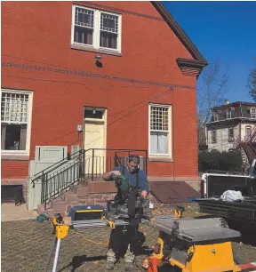  ?? CITIZEN NEWS SERVICE PHOTO ?? Chris Fullan, owner of Forever Hung Windows in Philadelph­ia, restores the windows on a Langhorne Borough, Pa., building. There are plenty of reasons to fix or replace windows, but wintry temperatur­es push many homeowners to get the job done. Besides the discomfort they cause, drafty windows can add hundreds of dollars to the energy bill over the course of a winter.