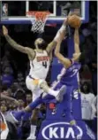  ?? MATT SLOCUM — THE ASSOCIATED PRESS ?? The Suns’ Tyson Chandler, left, blocks a shot by the 76ers’ Timothe Luwawu-Cabarrot during the second half Monday in Philadelph­ia. Phoenix won 115-101.