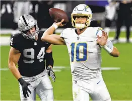  ?? DAVID BECKER AP ?? Los Angeles Chargers quarterbac­k Justin Herbert remains humble as he’s emerged as the team’s leader going forward after a remarkable rookie campaign.
