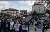  ?? PICTURE: AP ?? Dozens of members of a Turkish trade union carry coffins with images of victims in protest in Ankara against the chemical weapons attack that killed more than 70 people in northern Syria.