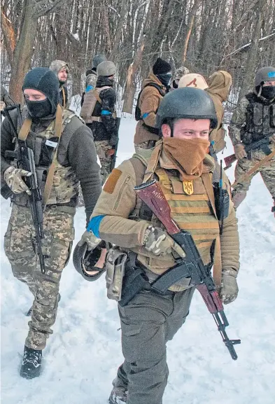  ?? Picture Andrew Marienko/ AP ?? Ukrainian servicemen training in the snow outside Kharkiv in northeast Ukraine on Friday