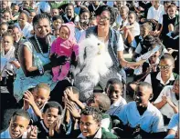  ?? Picture: FREDLIN ADRIAAN ?? POWERFUL WORDS: Alpha Primary School teachers Thelma Qungani and Carmen Gertze celebrate World Read Aloud Day with the pupils