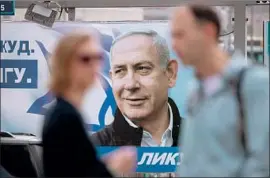  ?? Jim Hollander EPA/Shuttersto­ck ?? ISRAELI Prime Minister Netanyahu’s image on a billboard in Jerusalem. After Tuesday’s election, he could become Israel’s longest-serving prime minister.