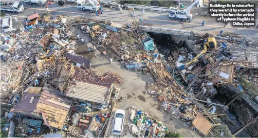  ??  ?? Buildings lie in ruins after they were hit by a tornado shortly before the arrival of Typhoon Hagibis in
Chiba, Japan