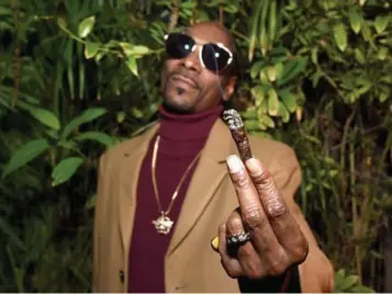  ?? GETTY IMAGES FOR GQ ?? There are zero pictures of the weed-loving rapper Snoop Dogg smoking a big blunt on his website.