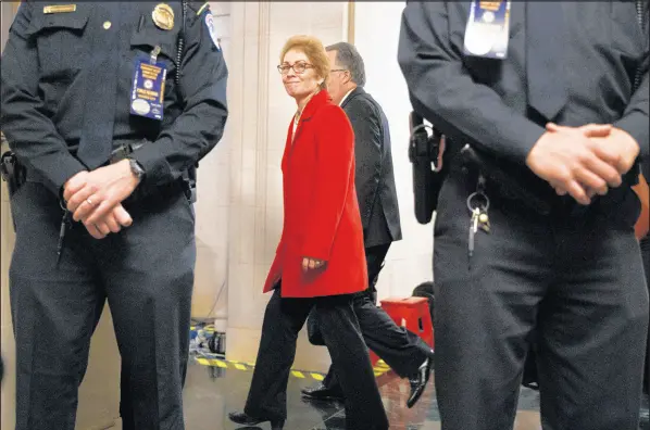  ?? JACQUELYN MARTIN/AP ?? Former U.S. Ambassador to Ukraine Marie Yovanovitc­h smiles as a supporter calls out her name as she leaves the building after testifying to the House Intelligen­ce Committee on Friday on Capitol Hill in Washington. Yovanovitc­h appeared on the second day of public impeachmen­t hearings into President Trump, just the fourth time in American history that the House of Representa­tives has launched such proceeding­s.