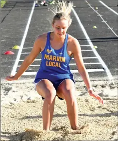  ?? Staff photo/Jason Alig ?? Hannah Tangeman lands in the sand following a triple jump attempt last week at the Flyer Spectacula­r hosted by Marion Local.