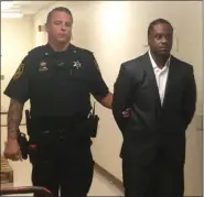  ?? CARL HESSLER JR. — MEDIANEWS GROUP ?? Bobbie Mitchell Jr. is led into court during his trial for homicide.