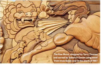  ??  ?? The Kew Mural, designed by Terry Thomas and carved by Robert H Games using wood from trees blown over in the storm of 1987