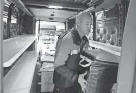  ?? ?? Jordan Drake loads packages into delivery truck. Drake says appearance is what people notice first because they’re virtually soundless.