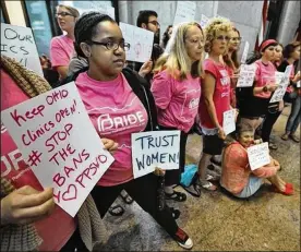  ?? DISPATCH 2015 ?? Abortion-rights protesters rally in the Statehouse atrium in 2015. The GOP-dominated legislatur­e passed the Down syndrome ban late last year.