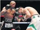  ?? /Getty Images ?? Gaining the upper hand: Moruti Mthalane, left, pounds Muhammad Waseem.