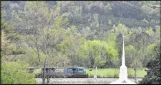  ?? BRANT SANDERLIN PHOTOS / BSANDERLIN@AJC.COM ?? A train passes Fairy Valley Baptist Church near Crandall. The church is directly across from a proposed inland port that could bring increased traffic, noise and loss of scenic views.