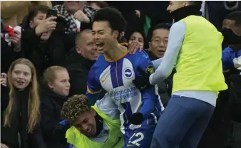  ?? AP ?? Brighton’s Kaoru Mitoma, centre, celebrates after scoring the winner against Liverpool