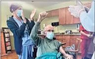  ?? Contribute­d photo / Eleanor Ferrara-Anderson ?? Santo Salafia, seated, celebrates after getting the Pfizer vaccine at Apple Rehab Middletown.