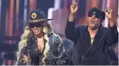  ?? MARIO ANZUONI/REUTERS ?? Beyonce accepts the Innovator award from Stevie Wonder at the iHeartRadi­o Music Awards in Los Angeles on Monday.