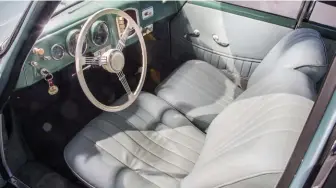  ??  ?? Below left: Light grey interior of the coupé contrasts with the green dashboard. Petri ʻbanjoʼ wheel is a great finishing touch