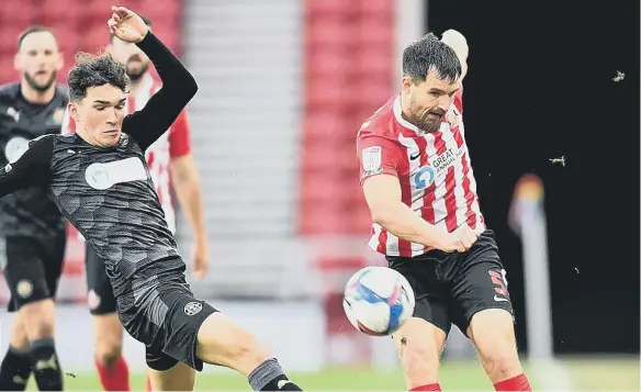  ??  ?? Bailey Wright in action against Wigan Athletic last season.