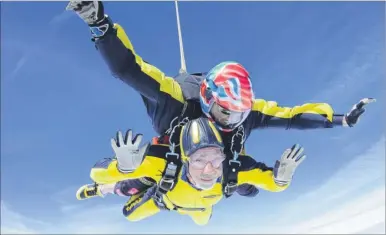  ??  ?? Ray Hulme flies through the air attached to his instructor