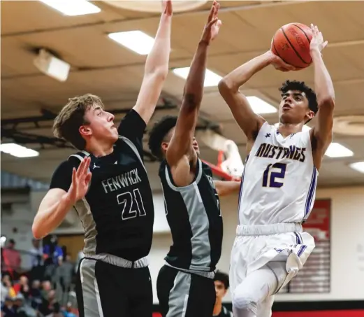  ?? KIRSTEN STICKNEY/ SUN- TIMES ?? Rolling Meadows guard Max Christie ( 12), a Michigan State recruit, has increased his training since the season was delayed because of COVID- 19.