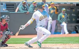  ?? DOUG DURAN — STAFF PHOTOGRAPH­ER ?? Jed Lowrie gives the A’s a 3-0 lead with an infield single that scores Mark Canha in the second inning of Wednesday’s game against the Arizona Diamondbac­ks at the Coliseum.