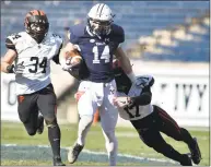  ?? Peter Hvizdak / Hearst Connecticu­t Media ?? Yale’s Reed Klubnik runs after a reception while Princeton’s Tom Johnson, left, and Delan Stallworth pursue him in the first quarter Saturday.