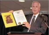  ?? MEDIANEWS GROUP FILE PHOTO ?? State Sen. Stewart Greenleaf, R-12, presents a resolution to Fort Washington Estates on its 40th anniversar­y in 2012.